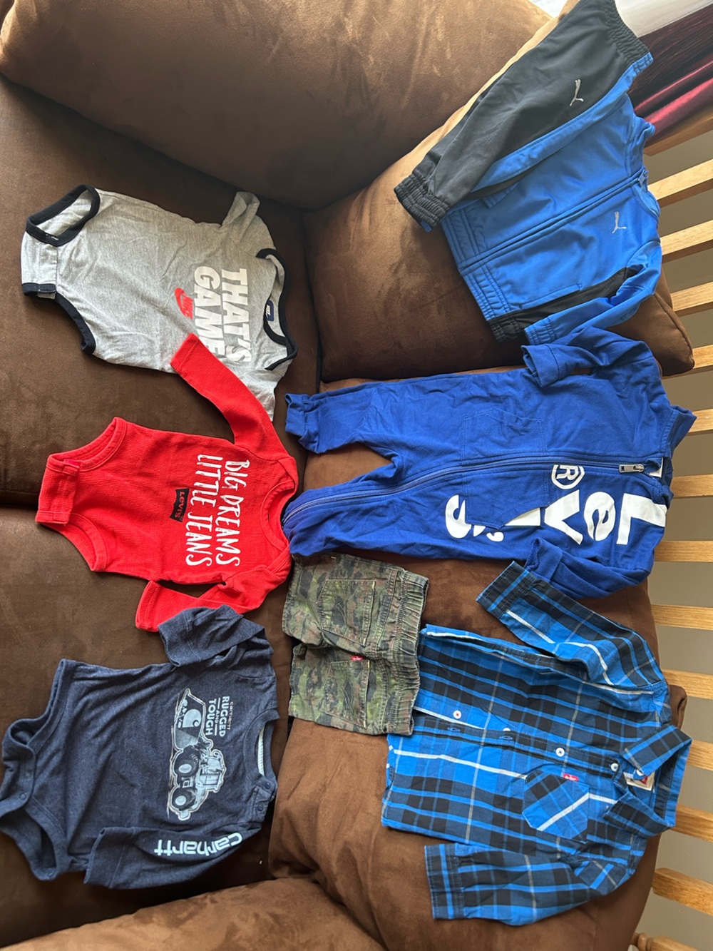 Lot of 7:Levi’s romper, onesie, shorts, buttonup, Puma suit, Nike onesie